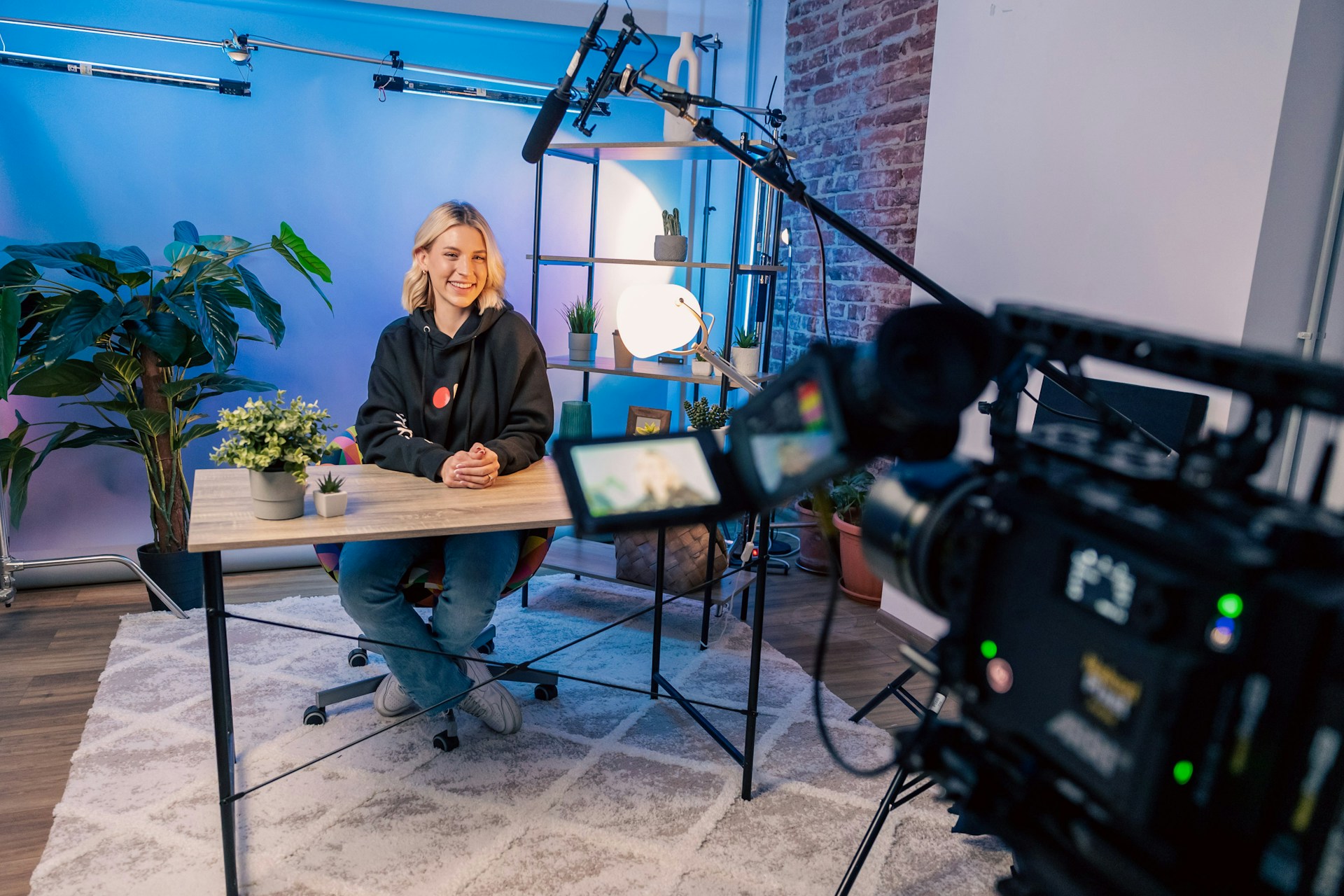 A presenter recording a video in a studio for law firm content marketing